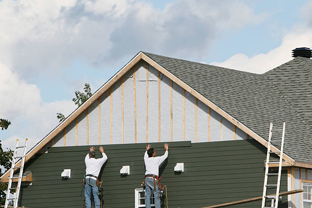 Professional Siding technician working in Islip Terrace, NY